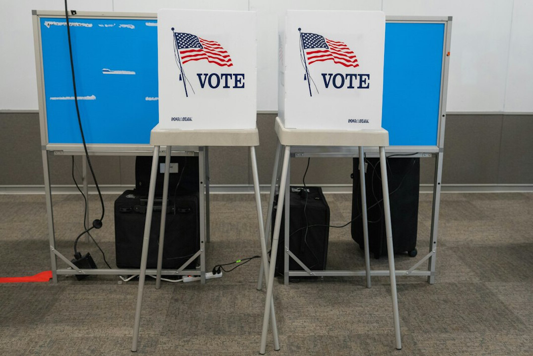 people voting in election booth
